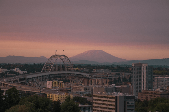The city of portland oregon with a mountain backdrop